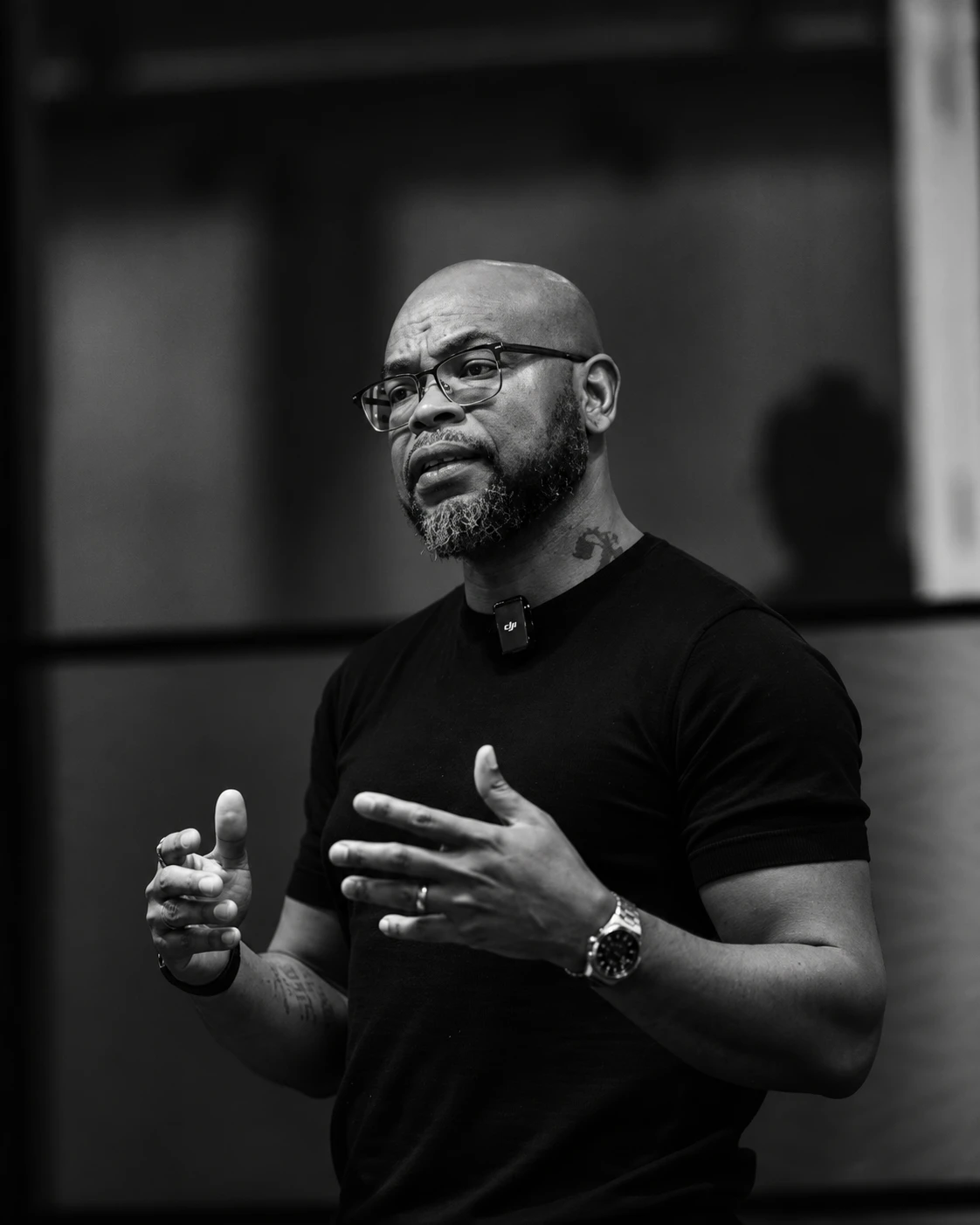 Horace Cyrus speaking and gesturing during a presentation.